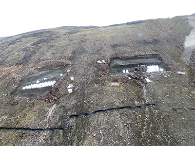 Sample pits B and D with white 'Mega-bags' filled with the A28 Unit of the Q1-4 kimberlite, Naujaat Diamond Project, Nunavut